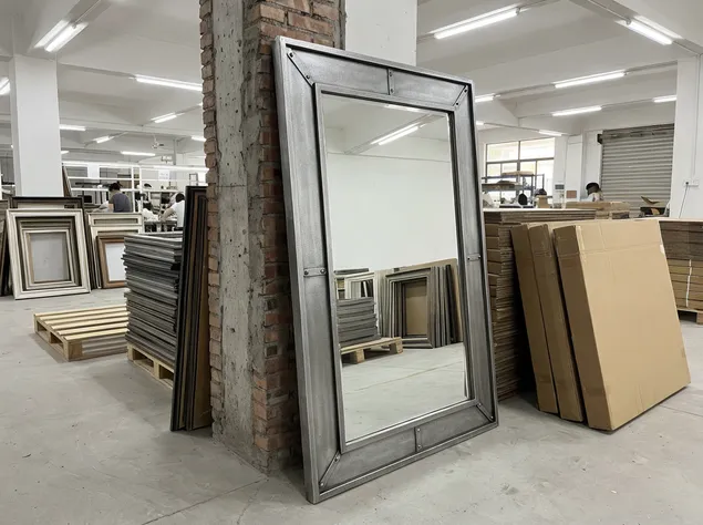 Pewter finish mirror frame with dark industrial character