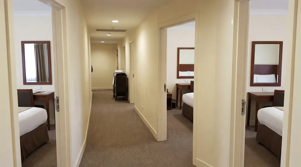 Consistent bedroom mirror installation across hotel guest rooms