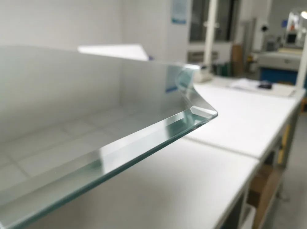 Close-up of 1-inch beveled glass edge on dining room mirror showing precision grinding and polishing