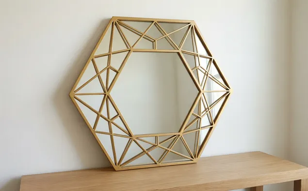 Hexagonal geometric mirror with gold powder-coat finish