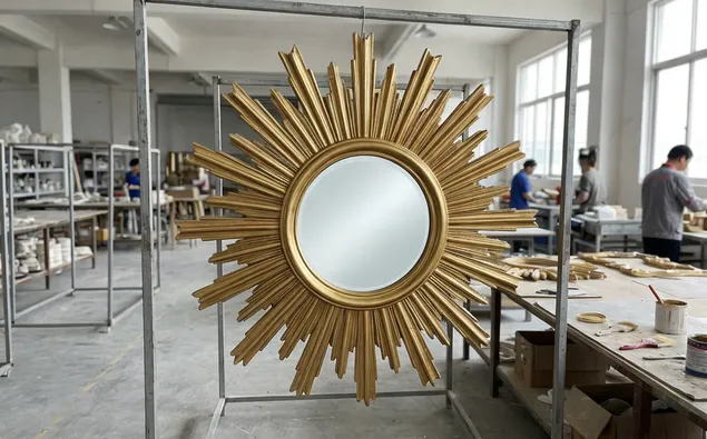 Gold sunburst mirror with hand-finished resin frame