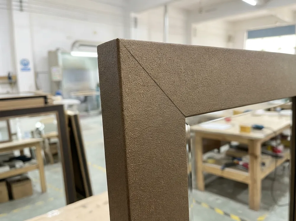 Close-up of heat-resistant frame finish on mantel mirror