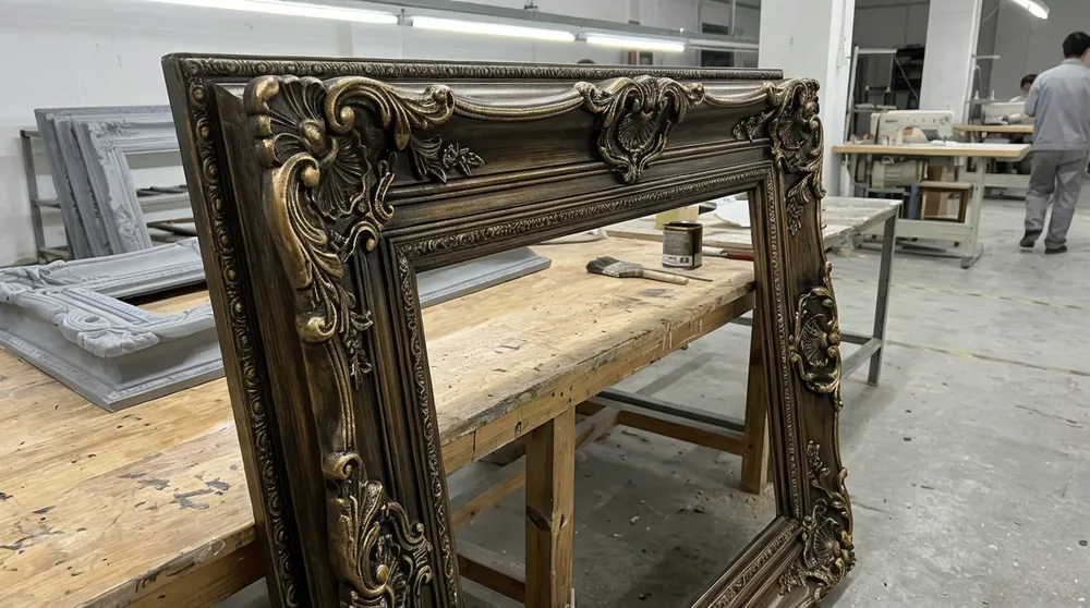 Resin composite mirror frame with intricate scrollwork and multi-layer antiquing finish