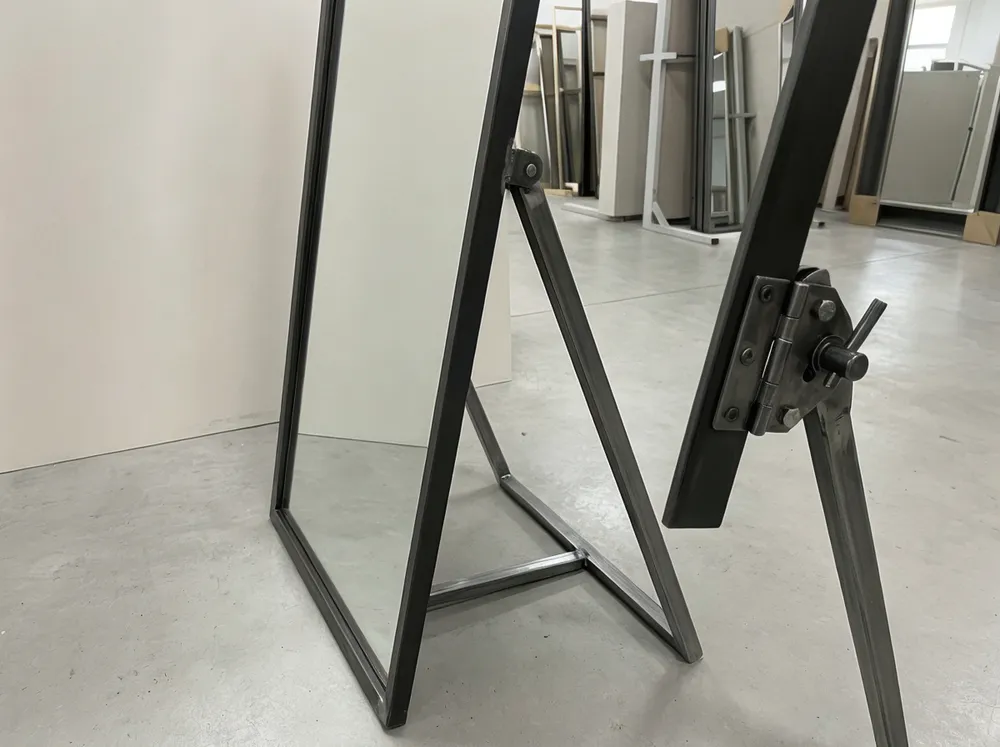 Easel-back floor mirror with steel friction-lock hinge strut detail