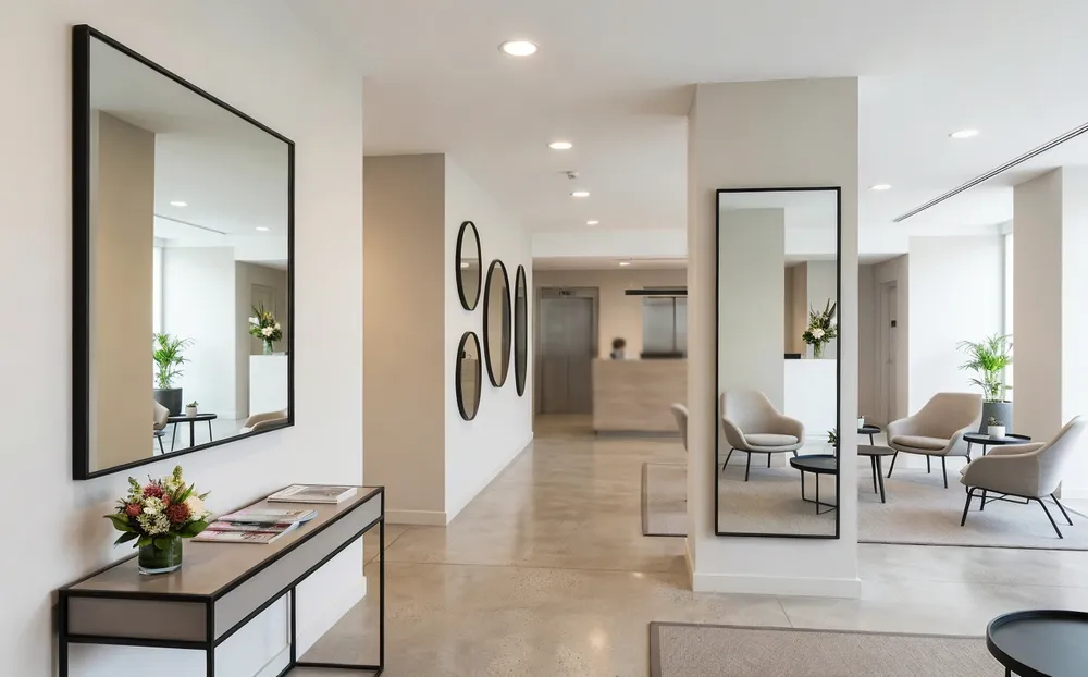 Modern mirrors installed in hotel lobby and commercial interior