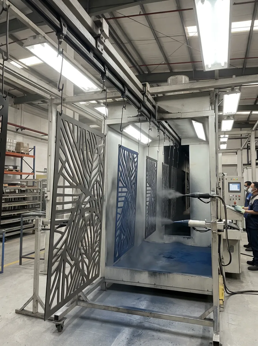 Automated powder coating line applying finish to metal wall art pieces