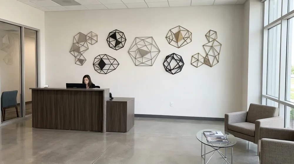 Geometric metal wall art in corporate office reception area