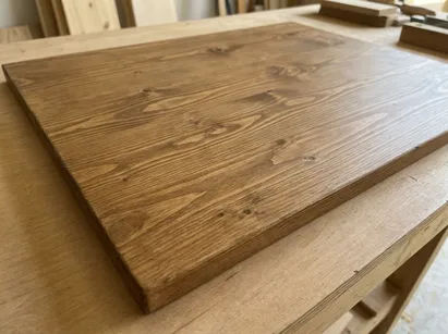 Pine substrate showing visible grain with stained finish