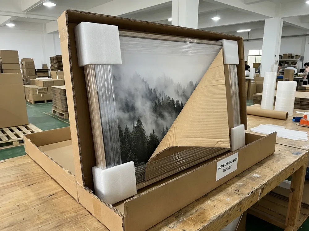 Nature wall art packaging with foam corners, poly wrap, and corrugated carton protection
