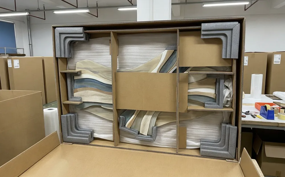 Custom-fitted foam corner protectors and internal bracing for dimensional wall art shipping