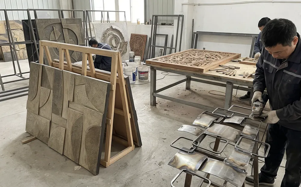 Cast resin, welded metal, and carved wood wall sculptures at Livewellcraft workshop